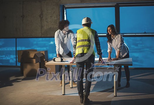 young team of business people in group, architect and engineer on construction site checking documents and business workflow using laptop computer in new startup office young team of business people in group, architect and engineer on construction site checking documents and business workflow using laptop computer in new startup office