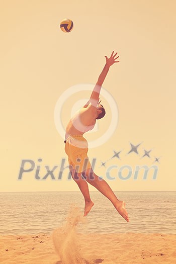 male beach volleyball game player jump on hot sand male beach volleyball game player jump on hot sand