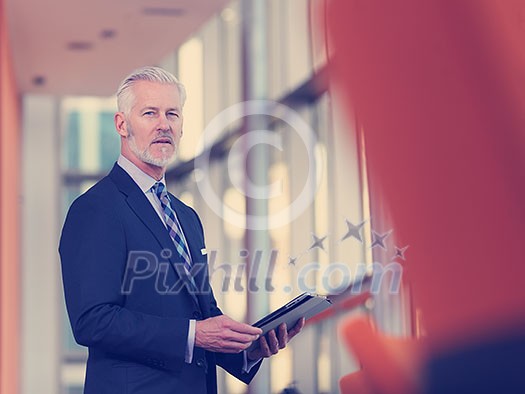senior business man working on tablet computer at office