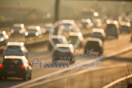 Heavy morning city traffic/congestion concept - cars going very slowly in a traffic jam during the morning rushhour - blurred photo