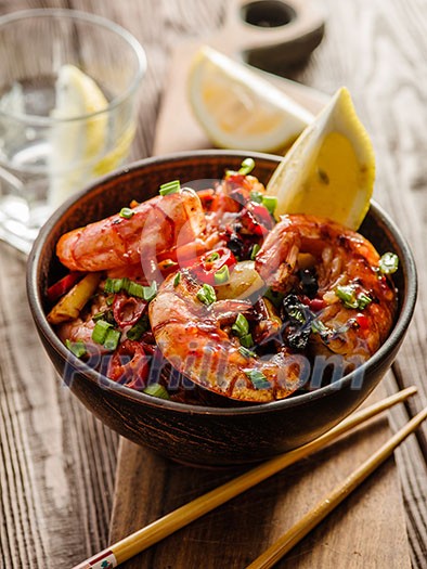 Large grilled BBQ shrimp with sweet chili sauce, green onion and lemon Large grilled BBQ shrimp with sweet chili sauce, green onion and lemon