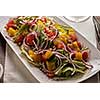 Salad with tomato pepper and onion. Healthy eating. Vegetable seasonal salad in white.