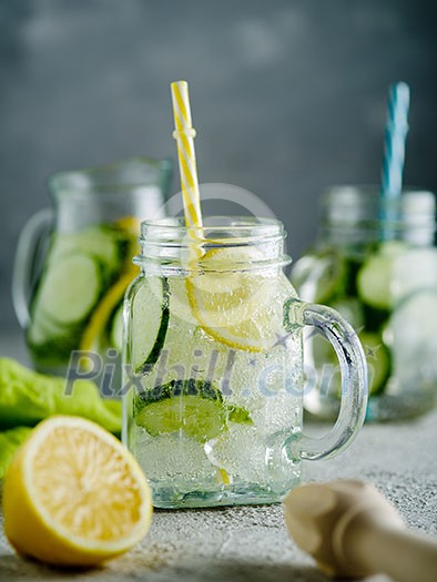 Fresh Summer Drink. Healthy detox fizzy lemonade with lemon and cucumber in mason jar. Healthy food concept. Detox diet. Fresh Summer Drink. Healthy detox fizzy lemonade with lemon and cucumber in mason jar. Healthy food concept. Detox diet.
