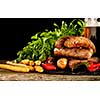 Grilled sausages with a glass of beer on a wooden table. Rustic style. Snacks for the Oktoberfest.
