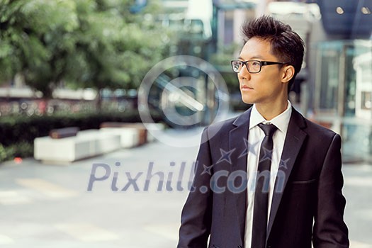Businessman outdoors in city business district Businessman outdoors in city business district