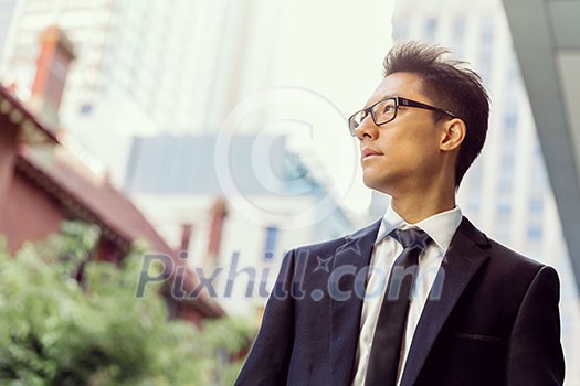 Businessman outdoors in city business district Businessman outdoors in city business district