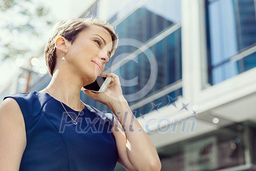 Businesswoman with a phone in a city Businesswoman with a phone in a city