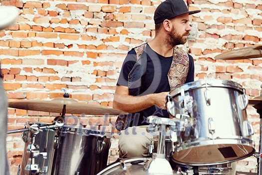 A street muscian playing drums A street muscian playing drums