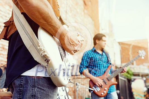 A street musician playing his guitar A street musician playing his guitar