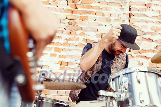 A street muscian playing drums A street muscian playing drums