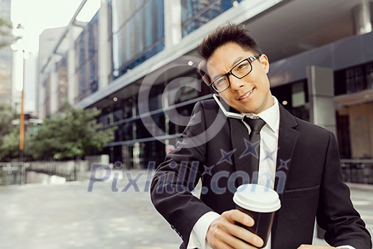 Businessman outdoors in city business district Businessman outdoors in city business district