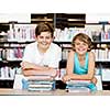 Two boys in library with books