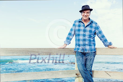 Portrait of an od man next to ocean