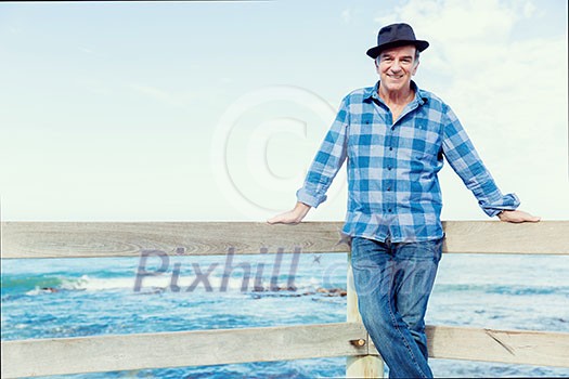 Portrait of an od man next to ocean Portrait of an od man next to ocean