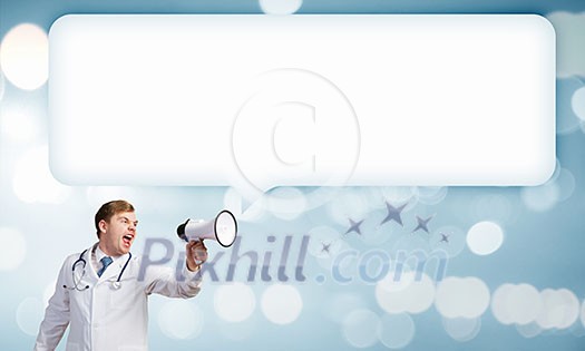 Young male doctor screaming in megaphone emotionally Young male doctor screaming in megaphone emotionally