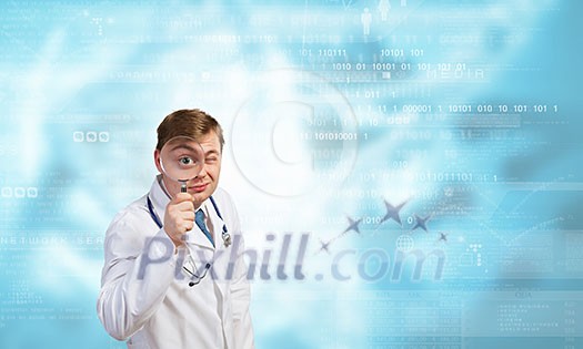 Funny young doctor with magnifier expecting something Funny young doctor with magnifier expecting something