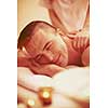 young handsome man have relaxing massage in spa and wellness salon