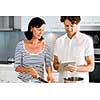 Couple cooking together in the modern kitchen at home