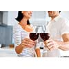 Portrait of a couple having a glass of red wine at home