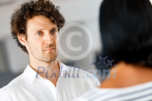 Portrait of a smart serious young man with curly hair Portrait of a smart serious young man with curly hair