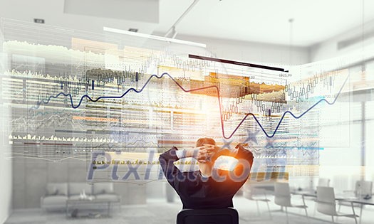 Relaxed businessman at the office sitting back with his hands behind his head Relaxed businessman at the office sitting back with his hands behind his head