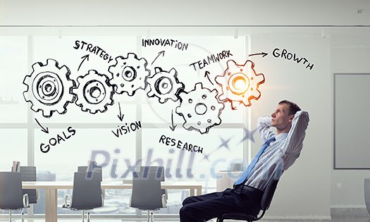 Relaxed businessman at the office sitting back with his hands behind his head Relaxed businessman at the office sitting back with his hands behind his head