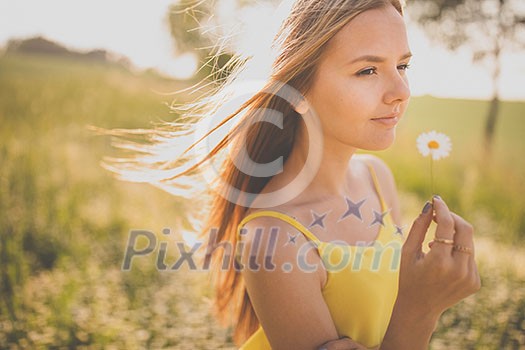 Portrait of young woman with radiant clean outdoor on a spring/summer sunny day Portrait of young woman with radiant clean outdoor on a spring/summer sunny day