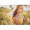 Portrait of young  woman with radiant clean outdoor on a spring/summer sunny day