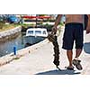 closeup picture of senior man carries a bag of fresh mussels