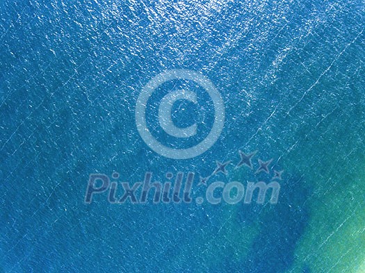 Blue sea surface summer sunny day. Aerial view of the drone as a natural layout Blue sea surface summer sunny day. Aerial view of the drone as a natural layout