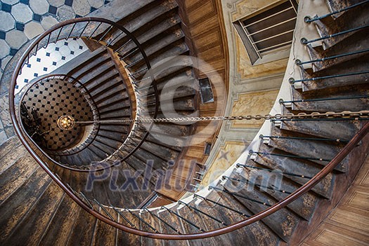 Paris, France - August 05, 2006: Beautiful vintage high spiral staircase in the gallery of Vivienne. Top view Paris, France - August 05, 2006: Beautiful vintage high spiral staircase in the gallery of Vivienne. Top view