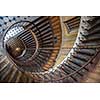Paris, France - August 05, 2006: Beautiful vintage high spiral staircase in the gallery of Vivienne. Top view