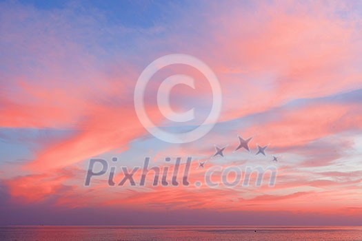 Blue sky at sunset with clouds of color living coral around the sea. Natural beautiful background Blue sky at sunset with clouds of color living coral around the sea. Natural beautiful background