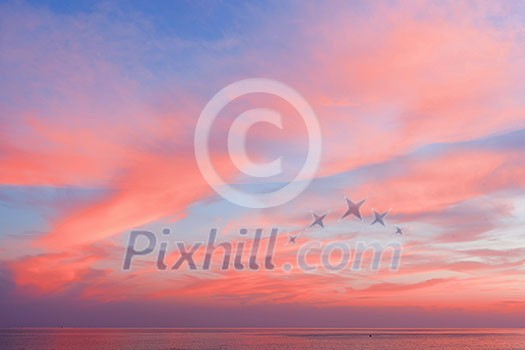 Blue sky at sunset with clouds of color living coral around the sea. Natural beautiful background