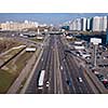 A bird's eye aerial view from drone to the Kharkivskiy district of Kiev, Ukraine with highway, road junction and modern buildings.