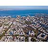 Panoramic view of the Black Sea with the port and the city from Spaso-Preobrazhensky Cathedral against the blue sky. Ukraine, Odessa. Aerial view from the drone