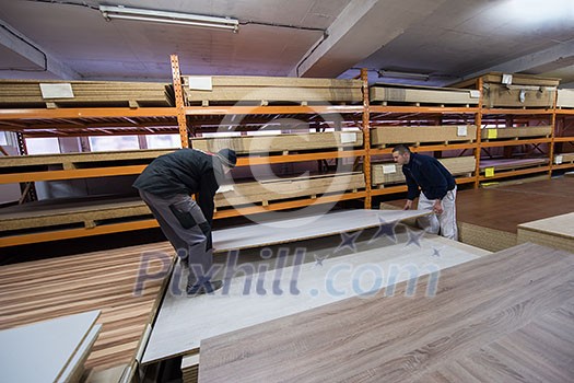 two young carpenters working together in big modern carpentry High quality wood concept