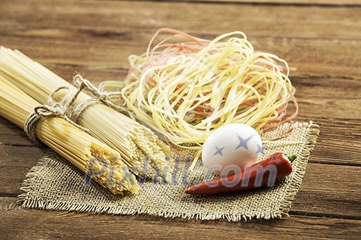 Close of spaghetti and eggs on table Close of spaghetti and eggs on table