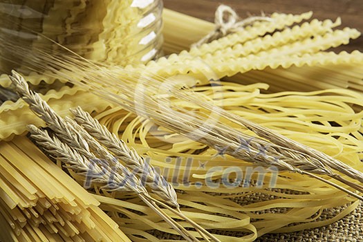 Variety of types and shapes of dry Italian pasta