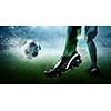 Foot of soccer player kicking ball. Mixed media