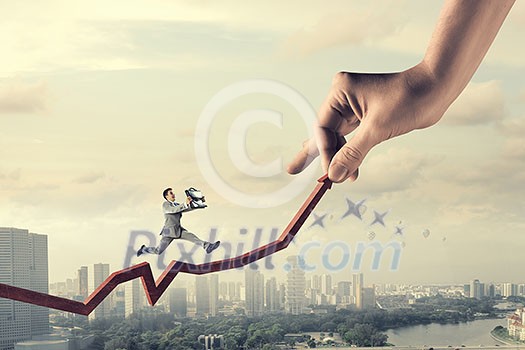 Businessman running on red arrow that going up. Mixed media Businessman running on red arrow that going up. Mixed media