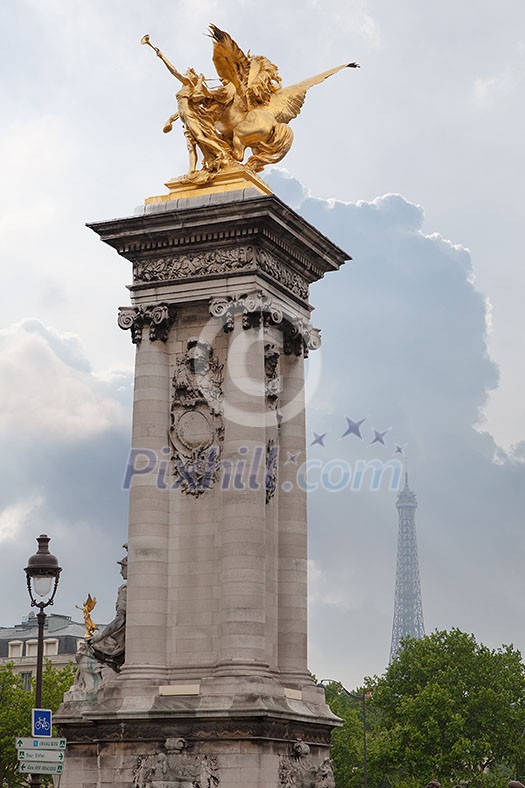 Sculpture on Alexandre III bridge. Pont Alexandre III is an arch famous bridge that spans Seine, connecting Champs-Elysees quarter and Invalides. It is a historical monument. Paris, France. Sculpture on Alexandre III bridge. Pont Alexandre III is an arch famous bridge that spans Seine, connecting Champs-Elysees quarter and Invalides. It is a historical monument. Paris, France.