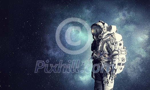 Spaceman wearing astronaut suit outdoor. Mixed media