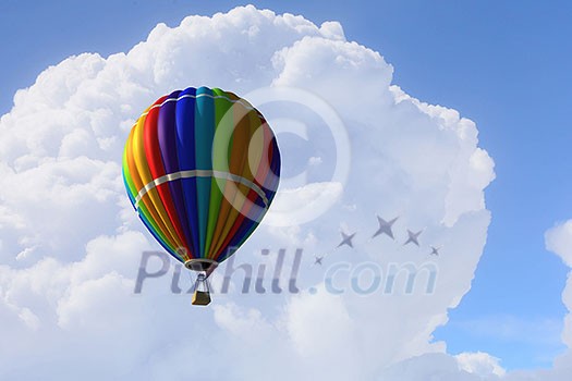 Colorful hot air balloon in blue sky. Mixed media