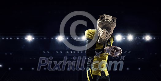 American football player with rhino animal head. Mixed media