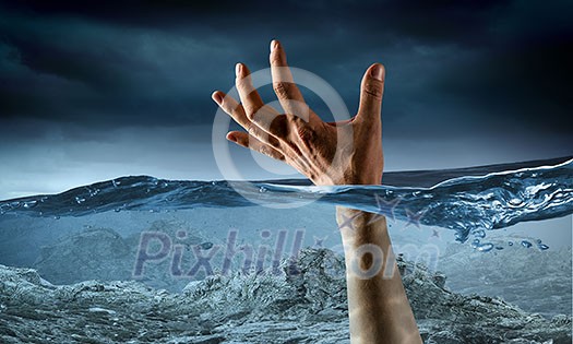 Man drowning in sea and asking for hand of help