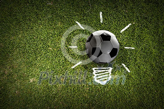 Light bulb and soccer ball as sign for creativity Light bulb and soccer ball as sign for creativity