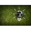 Light bulb and soccer ball as sign for creativity