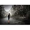 Young businesswoman with papers in hands in summer forest. Mixed media