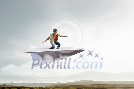 Teenager guy surfing the sky on paper plane. Mixed media